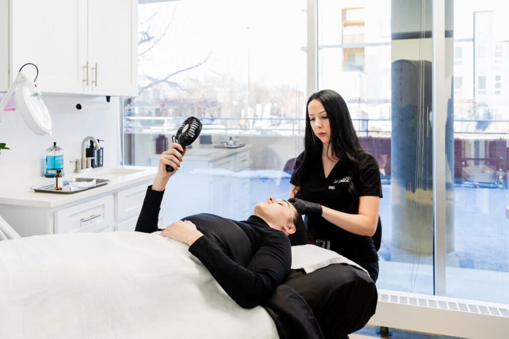A patient receives a chemical peel for skin texture treatments in Denver, CO